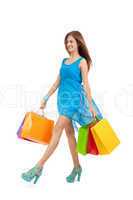 attractive young woman with colorful shopping bags isolated