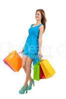 attractive young woman with colorful shopping bags isolated