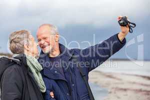 Elderly couple taking a self portrait