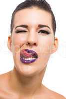 Graceful attractive woman with purple lips and nails