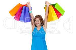 attractive young woman with colorful shopping bags isolated