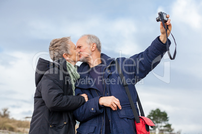 Elderly couple taking a self portrait