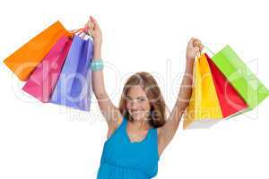 attractive young woman with colorful shopping bags isolated