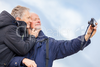 Elderly couple taking a self portrait