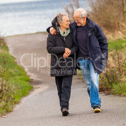 happy mature couple relaxing baltic sea dunes