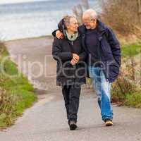 happy mature couple relaxing baltic sea dunes