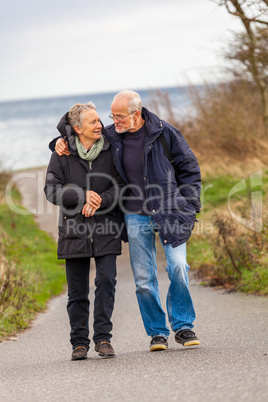 happy mature couple relaxing baltic sea dunes