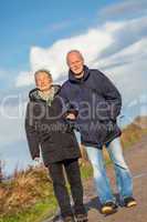 happy mature couple relaxing baltic sea dunes