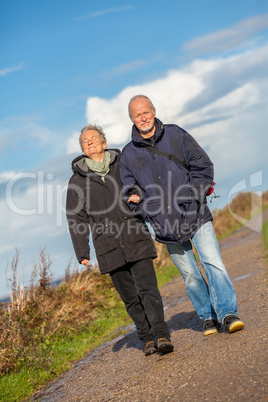 happy mature couple relaxing baltic sea dunes