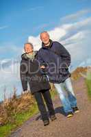 happy mature couple relaxing baltic sea dunes