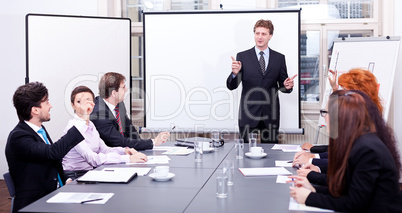 business team on table in office conference