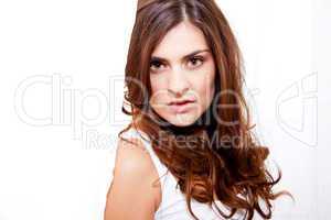 brunette woman in sunlight at window looking sensual