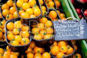 fresh tasty yellow cherry tomatoes macro closeup on market