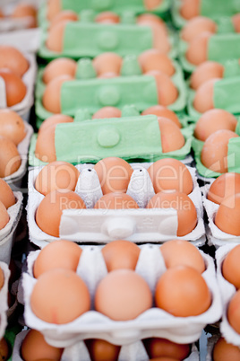 group of eggs in carton box closeup market outdoor