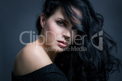 Dark moody portrait of a brunette beauty