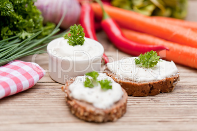 fresh tasty homemade cream cheese and herbs with bread