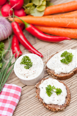 fresh tasty homemade cream cheese and herbs with bread