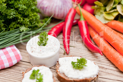 fresh tasty homemade cream cheese and herbs with bread