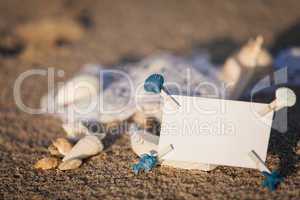 sailing boat and seashell in sand decoration closeup