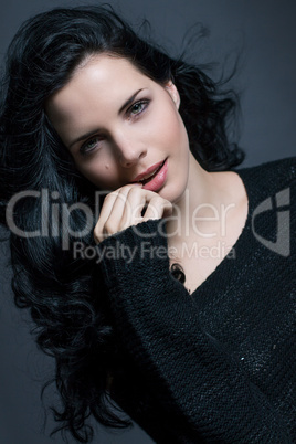 Dark moody portrait of a brunette beauty