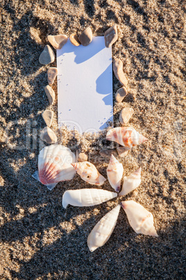 sailing boat and seashell in sand decoration closeup