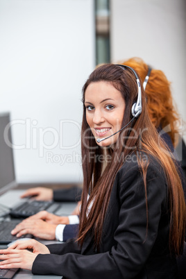 friendly callcenter agent operator with headset telephone
