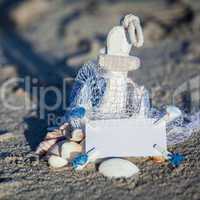 sailing boat and seashell in sand decoration closeup