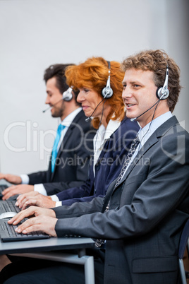 friendly callcenter agent operator with headset telephone
