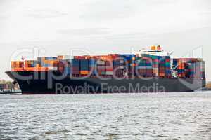 Fully laden container ship in port