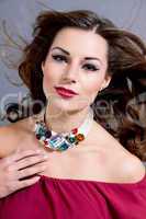 attractive brunette woman with glamour jewellry