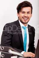young businessman smiling at office
