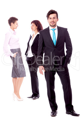 young successful business man in front a group