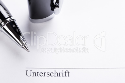 macro closeup sign document contract pen filler