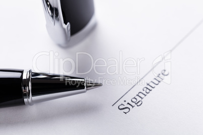 macro closeup sign document contract pen filler