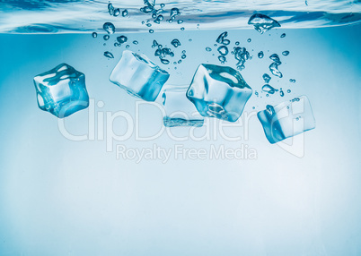 Ice cubes falling under water