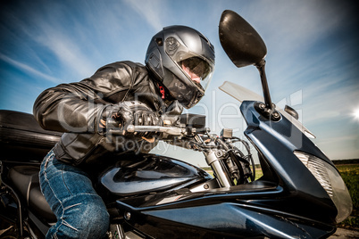 Biker racing on the road