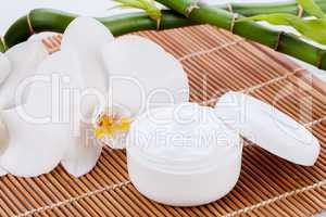 cosmetic face cream on wooden background