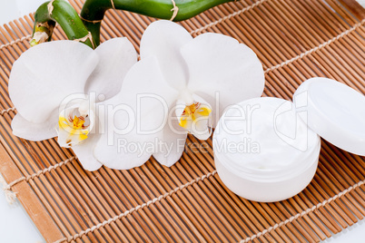 cosmetic face cream on wooden background