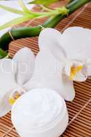 cosmetic face cream on wooden background