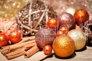 glittering christmas decoration in orange and brown natural wood