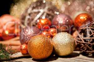 glittering christmas decoration in orange and brown natural wood