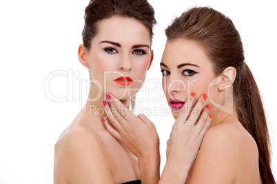 two beautiful girls with colorfull makeup isolated