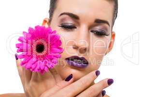 Beautiful woman in purple make-up