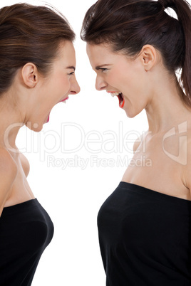 two young girls angry shouting loud isolated