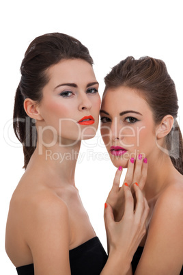 two beautiful girls with colorful makeup isolated