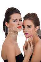 two beautiful girls with colorful makeup isolated