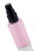 pink plastic bottle of cosmetic cream isolated on white