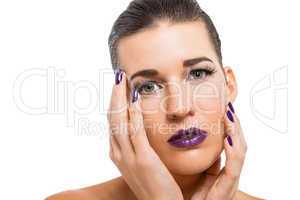 Graceful attractive woman with purple lips and nails