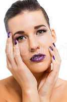 Graceful attractive woman with purple lips and nails
