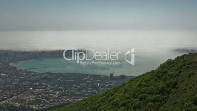 Town. Sea. Clouds. Timelapse.